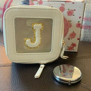 Stylish White and Gold Initial cometic case with a small mirror
